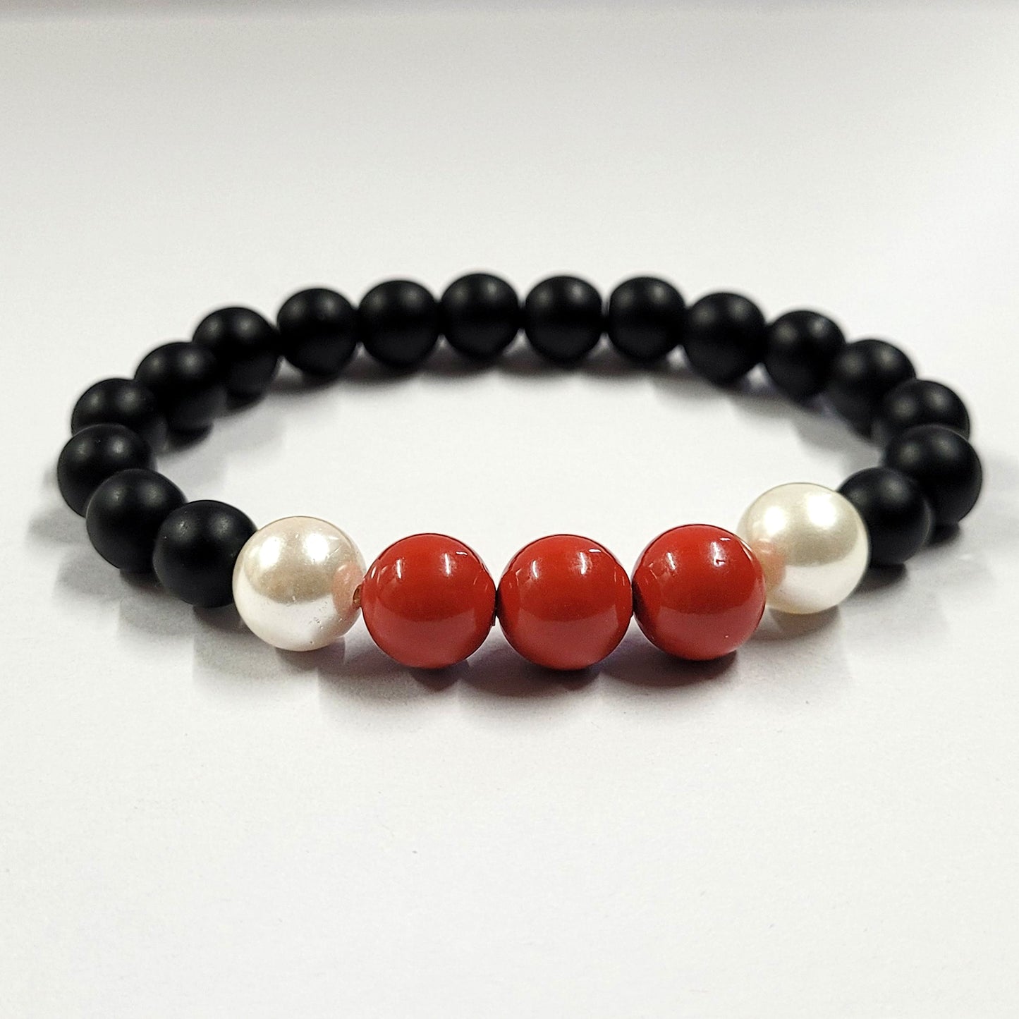 Red And White Shell Pearls 10mm Bracelet With 8mm Black Beads